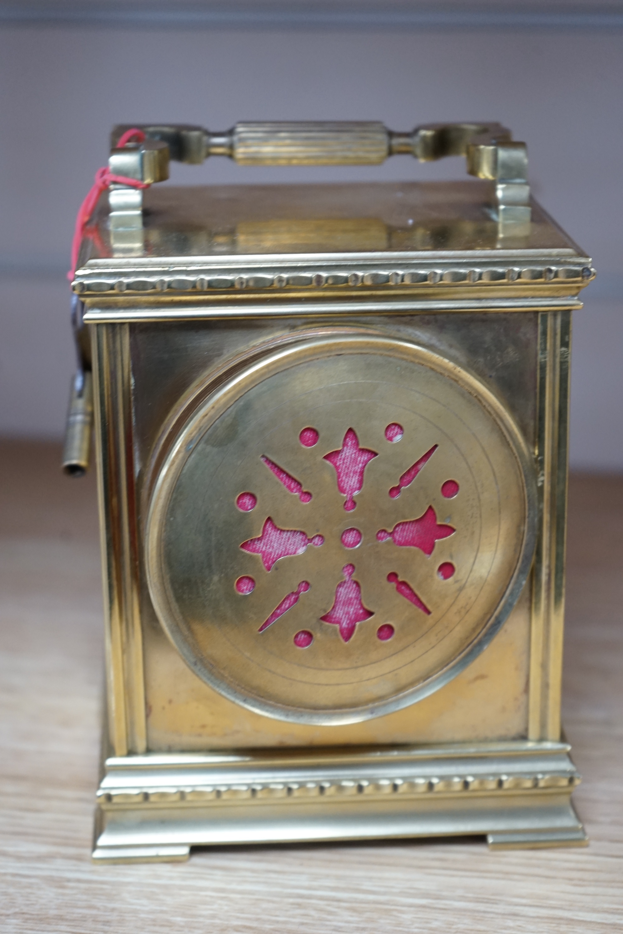 A late 19th century French brass large carriage clock with convex enamel dial, retailed by Robinson & Co. with key, 17cm. Condition - fair to good, not tested as working